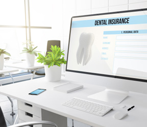 Dental insurance form on desktop in office
