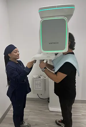 Dental patient receiving 3 D C T cone beam x-ray scans